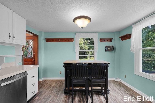 4305 76th St SW, Byron Center, MI 49315 - dining space with a textured ceiling and dark wood-style flooring
