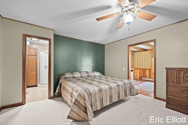 4305 76th St SW, Byron Center, MI 49315 - carpeted bedroom with a baseboard radiator, crown molding, connected bathroom, and ceiling fan