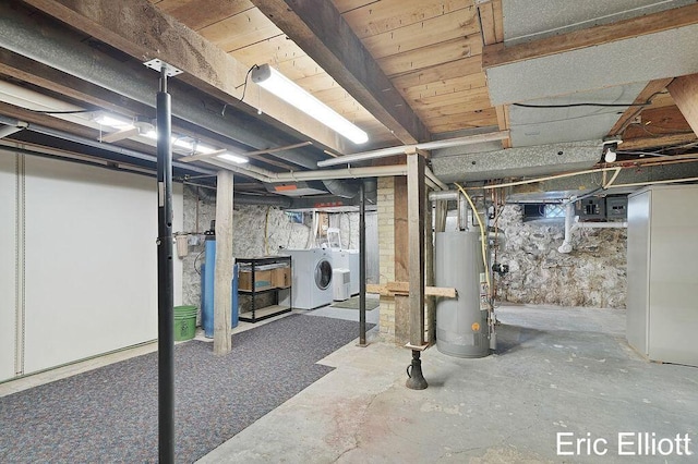 4305 76th St SW, Byron Center, MI 49315 - unfinished basement featuring water heater and washing machine and clothes dryer