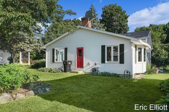 4305 76th St SW, Byron Center, MI 49315 - view of front of home featuring a chimney and a front yard