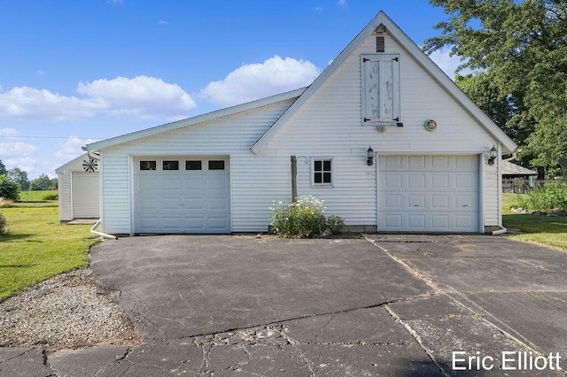 4305 76th St SW, Byron Center, MI 49315 - view of home's exterior with concrete driveway and an outdoor structure