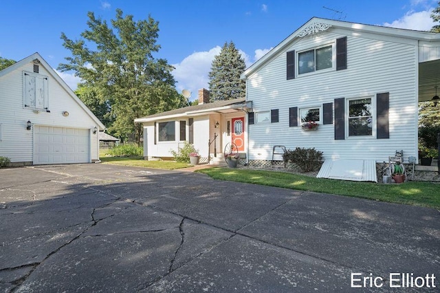 4305 76th St SW, Byron Center, MI 49315 - traditional home with a detached garage, an outbuilding, a chimney, and entry steps