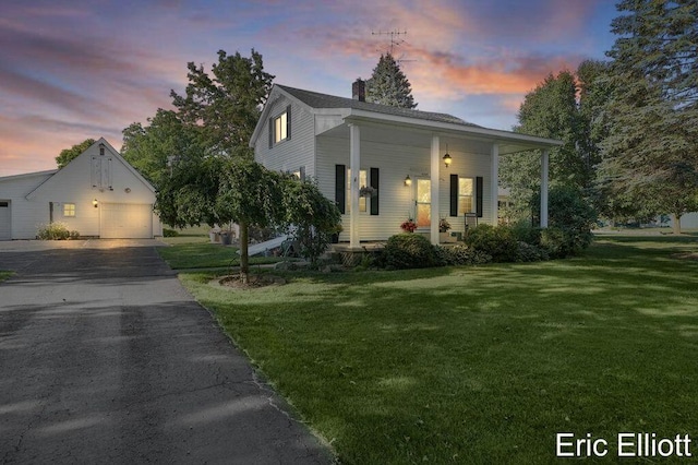 4305 76th St SW, Byron Center, MI 49315 - bungalow-style house with a porch, a lawn, a chimney, and an outbuilding