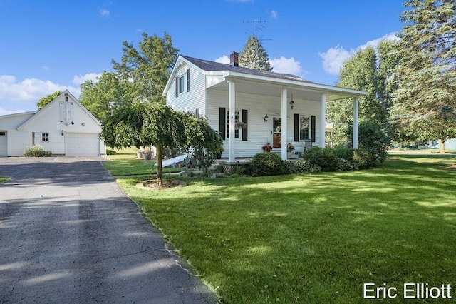 4305 76th St SW, Byron Center, MI 49315 - view of front of house featuring a porch, a front lawn, a detached garage, and a chimney
