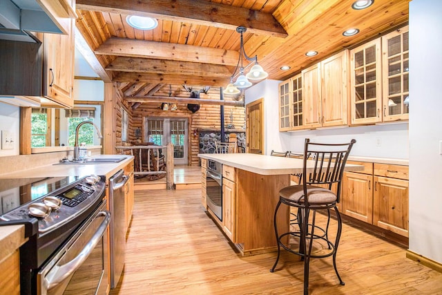 11463 Snowshoe Dr, Plainwell, MI 49080 - kitchen with stainless steel appliances, log walls, a wooden ceiling with exposed beams, light wood-type flooring, and light countertops