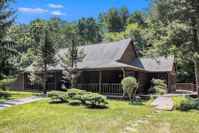 11463 Snowshoe Dr, Plainwell, MI 49080 - back of property with a lawn, a shingled roof, and a wooden deck