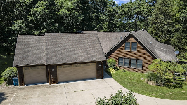 11463 Snowshoe Dr, Plainwell, MI 49080 - chalet / cabin with concrete driveway, an attached garage, roof with shingles, and a front lawn