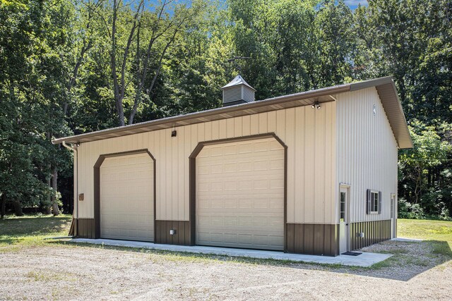 11463 Snowshoe Dr, Plainwell, MI 49080 - detached garage featuring view of wooded area