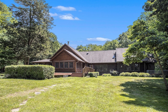 11463 Snowshoe Dr, Plainwell, MI 49080 - rear view of house featuring a yard and a wooden deck