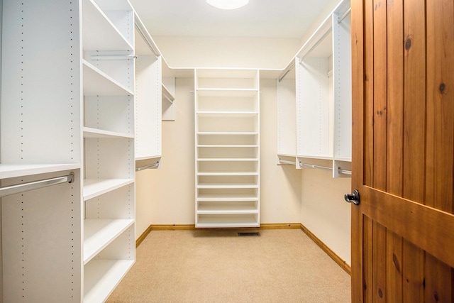 11463 Snowshoe Dr, Plainwell, MI 49080 - walk in closet featuring carpet flooring