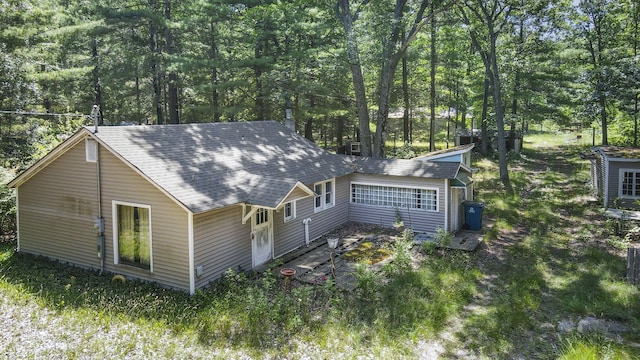 2267 Caberfae Hwy, Manistee, MI 49660 - view of side of property featuring a shingled roof