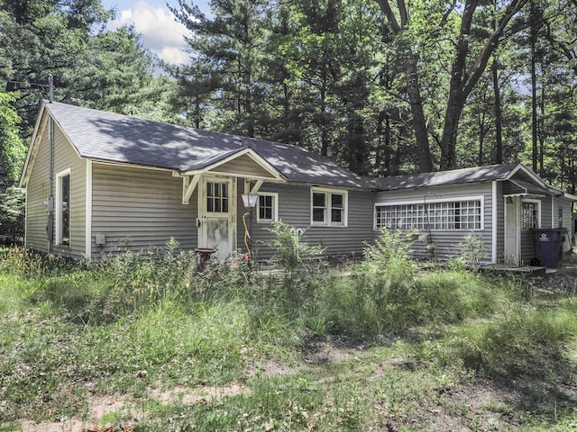 2267 Caberfae Hwy, Manistee, MI 49660 - view of front of home with a shingled roof