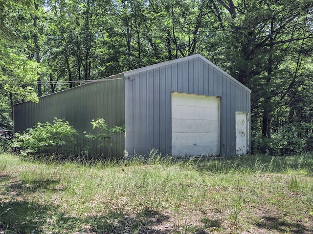 2267 Caberfae Hwy, Manistee, MI 49660 - detached garage featuring a forest view