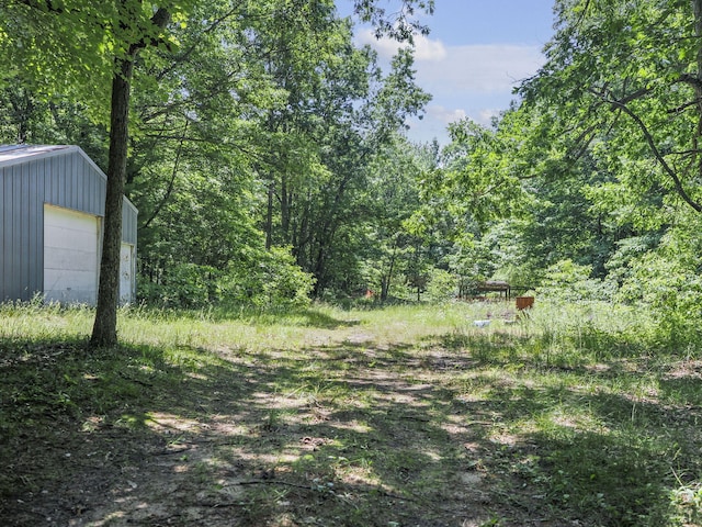 2267 Caberfae Hwy, Manistee, MI 49660 - view of yard with a view of trees and an outdoor structure