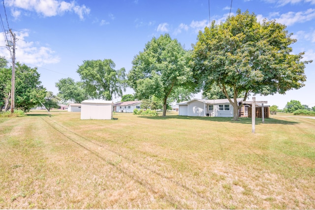 18165 Shamrock Blvd, Big Rapids, MI 49307 - view of grassy yard with an outdoor structure