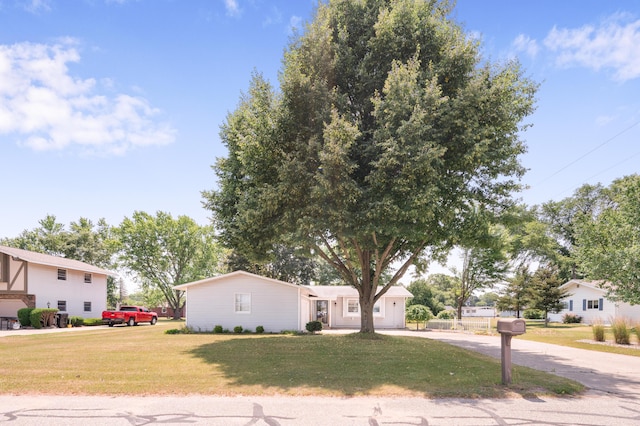 18165 Shamrock Blvd, Big Rapids, MI 49307 - ranch-style home with a front lawn and driveway