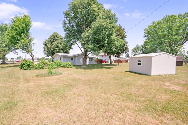 18165 Shamrock Blvd, Big Rapids, MI 49307 - view of grassy yard with an outdoor structure