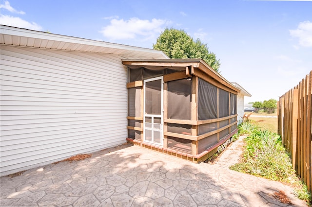 18165 Shamrock Blvd, Big Rapids, MI 49307 - view of patio / terrace featuring a sunroom