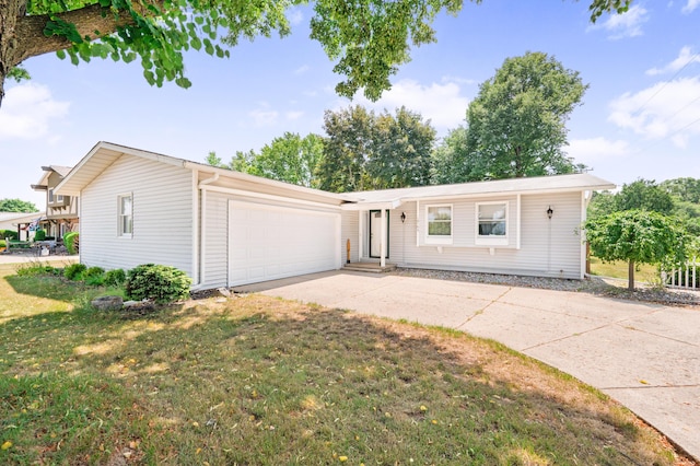 18165 Shamrock Blvd, Big Rapids, MI 49307 - single story home with an attached garage, driveway, and a front lawn
