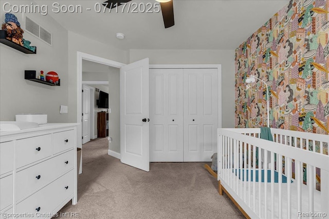 1305 Wyandotte Ave, Royal Oak, MI 48067 - bedroom featuring light colored carpet, a closet, a nursery area, and ceiling fan