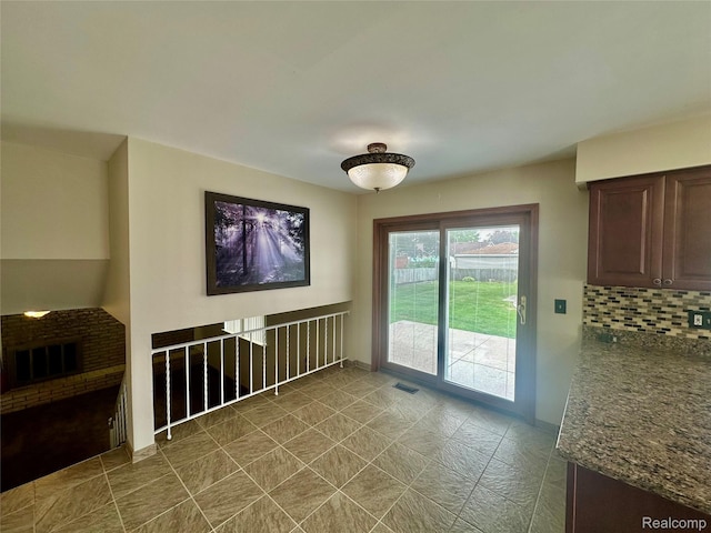 25631 Statler St, Taylor, MI 48180 - unfurnished dining area featuring baseboards and dark tile patterned flooring