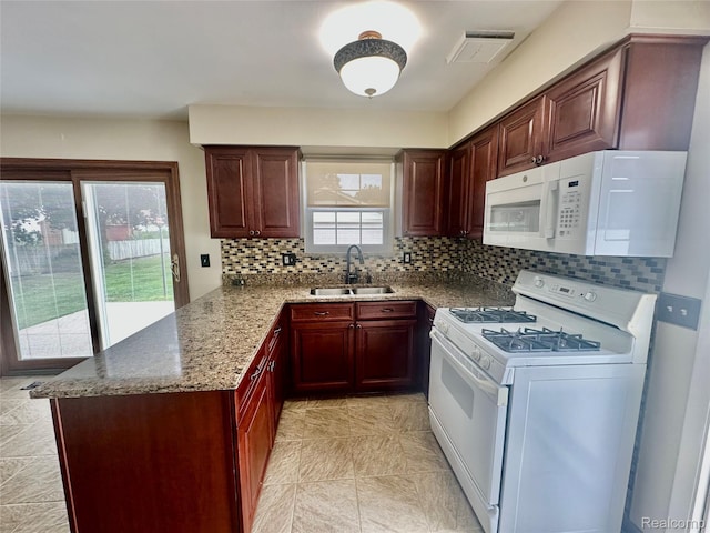 25631 Statler St, Taylor, MI 48180 - kitchen featuring white appliances, decorative backsplash, stone counters, a peninsula, and light tile patterned floors
