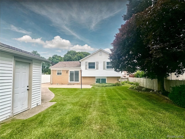 25631 Statler St, Taylor, MI 48180 - rear view of house with a patio, an outdoor structure, and brick siding