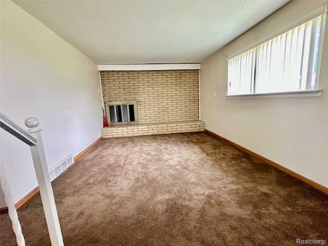 25631 Statler St, Taylor, MI 48180 - unfurnished living room featuring carpet floors and a brick fireplace