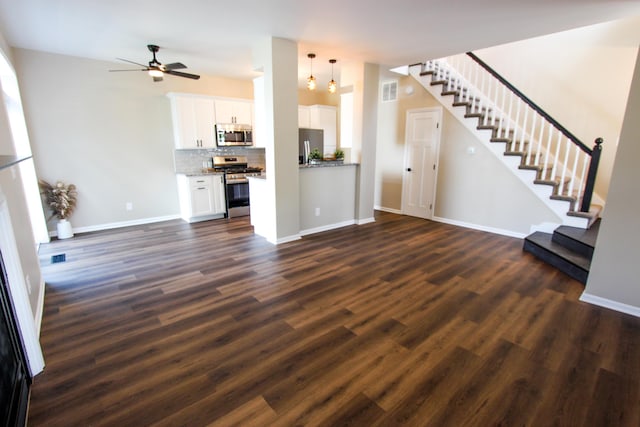 3216 E Morgan Creek Ct, Indiana, IN 46385 - unfurnished living room featuring stairway, dark wood-type flooring, and a ceiling fan