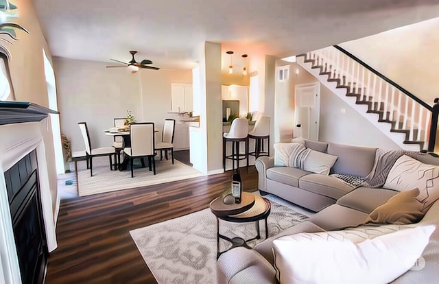 3216 E Morgan Creek Ct, Indiana, IN 46385 - living room with dark wood-style floors, ceiling fan, stairway, and a fireplace