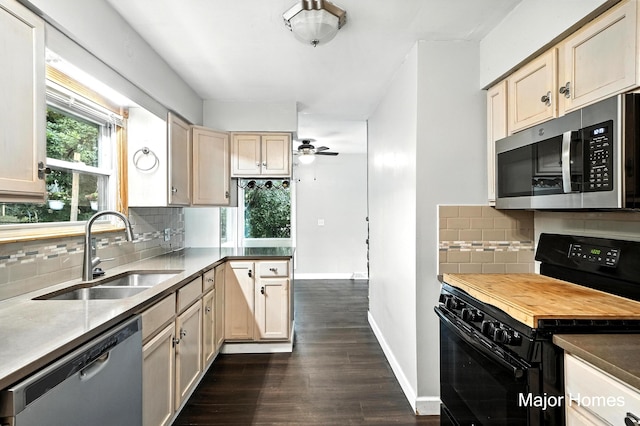 1435 Sweet St NE, Grand Rapids, MI 49505 - kitchen with appliances with stainless steel finishes, dark wood-style flooring, decorative backsplash, and a ceiling fan