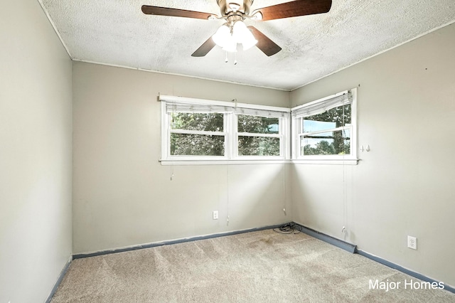 1435 Sweet St NE, Grand Rapids, MI 49505 - spare room with carpet flooring, a textured ceiling, and a ceiling fan