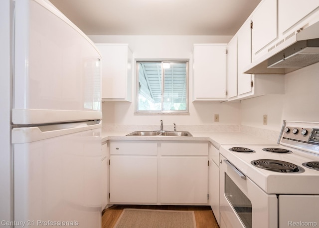 5959 Alan Dr # 56, Brighton, MI 48116 - kitchen with refrigerator, electric stove, under cabinet range hood, white cabinetry, and light wood-style floors