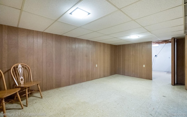 5959 Alan Dr # 56, Brighton, MI 48116 - finished basement with tile patterned floors, a drop ceiling, and wood walls