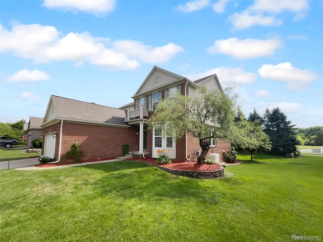 1960 Frances Way, Ypsilanti, MI 48198 - view of front of house with brick siding, a front yard, a garage, concrete driveway, and a balcony