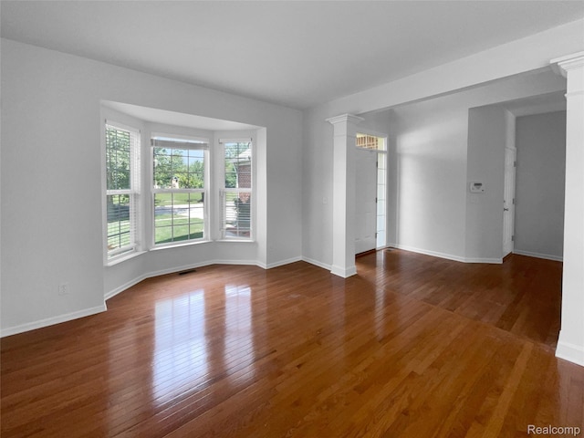 1960 Frances Way, Ypsilanti, MI 48198 - spare room with ornate columns and wood finished floors