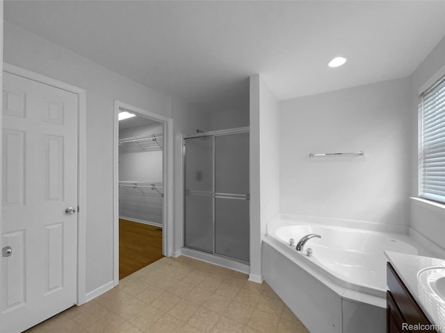 1960 Frances Way, Ypsilanti, MI 48198 - bathroom with a stall shower, a bath, tile patterned floors, a walk in closet, and vanity