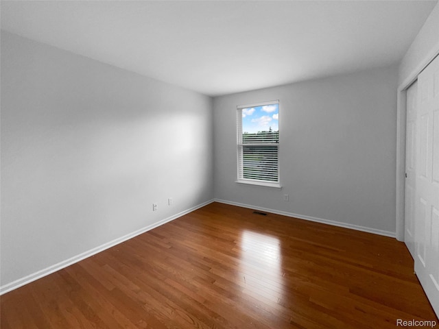 1960 Frances Way, Ypsilanti, MI 48198 - unfurnished bedroom with wood finished floors and a closet