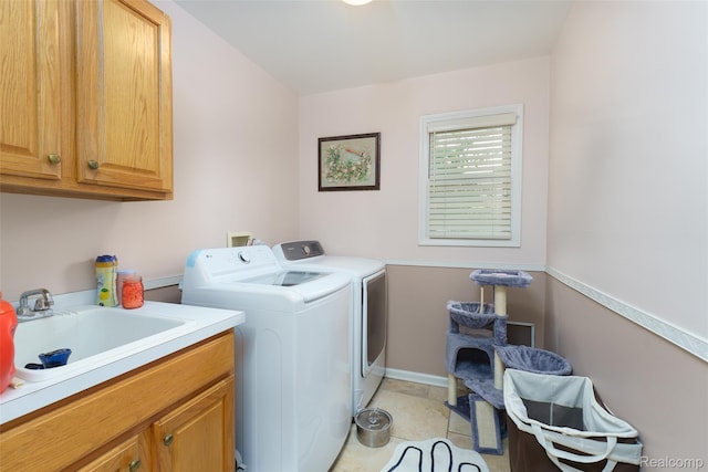 13381 Latheron Dr, Plymouth, MI 48170 - washroom featuring cabinet space, separate washer and dryer, and light tile patterned floors
