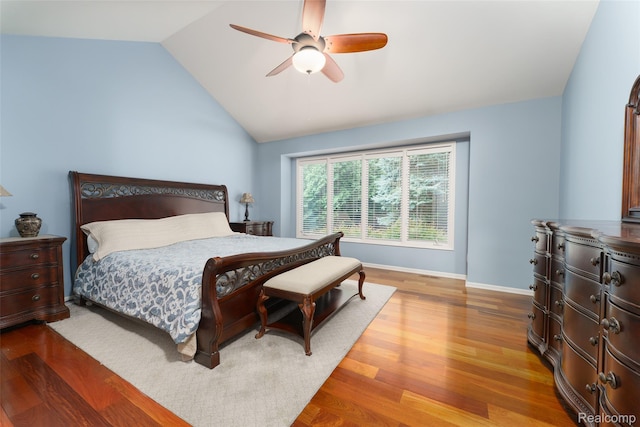 13381 Latheron Dr, Plymouth, MI 48170 - bedroom with wood finished floors, vaulted ceiling, and a ceiling fan