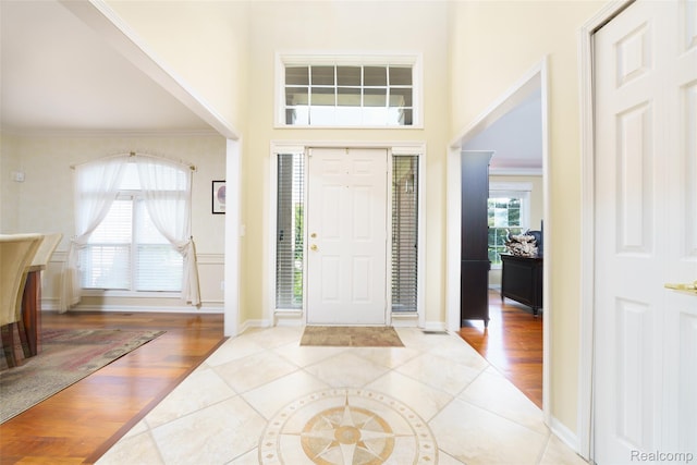 13381 Latheron Dr, Plymouth, MI 48170 - foyer featuring a high ceiling, wood finished floors, and ornamental molding