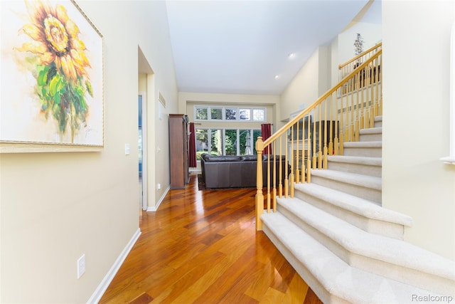 13381 Latheron Dr, Plymouth, MI 48170 - entrance foyer featuring stairs, wood finished floors, and vaulted ceiling