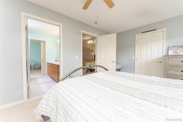 13381 Latheron Dr, Plymouth, MI 48170 - bedroom with light colored carpet, ensuite bathroom, and ceiling fan