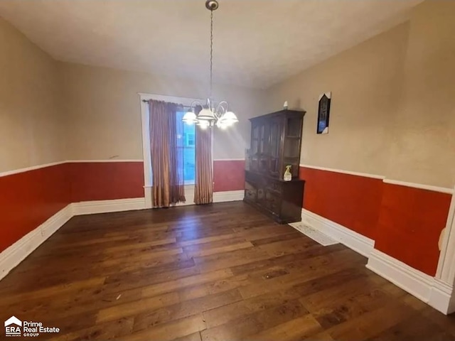 108 N Mercer St, Durand, MI 48429 - unfurnished dining area featuring wood finished floors and a chandelier