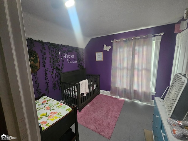 108 N Mercer St, Durand, MI 48429 - bedroom with a crib and lofted ceiling