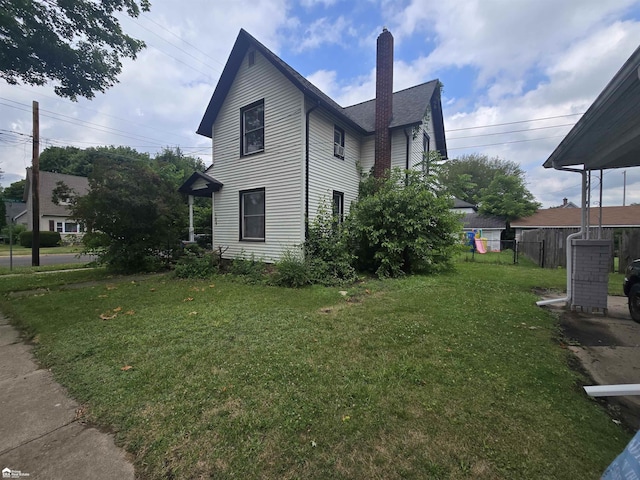 108 N Mercer St, Durand, MI 48429 - view of side of property with a chimney