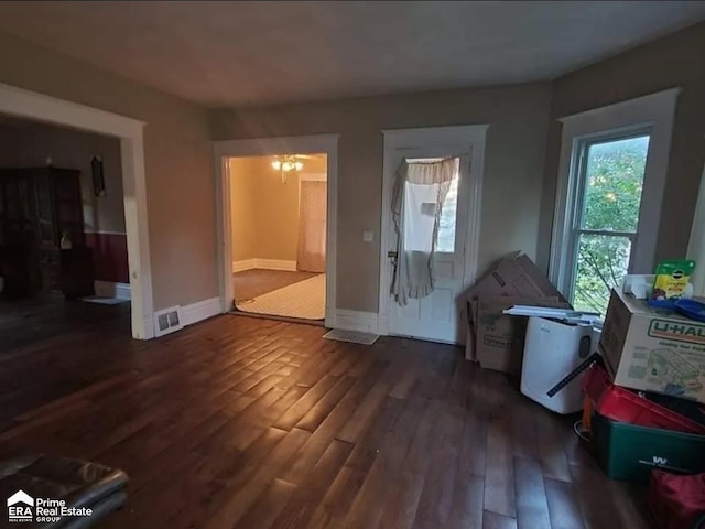 108 N Mercer St, Durand, MI 48429 - living room with wood finished floors and a chandelier
