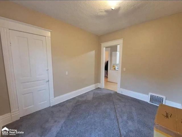 108 N Mercer St, Durand, MI 48429 - unfurnished room with carpet and a textured ceiling