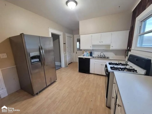 108 N Mercer St, Durand, MI 48429 - kitchen with stainless steel fridge with ice dispenser, white gas range, black dishwasher, light countertops, and white cabinets