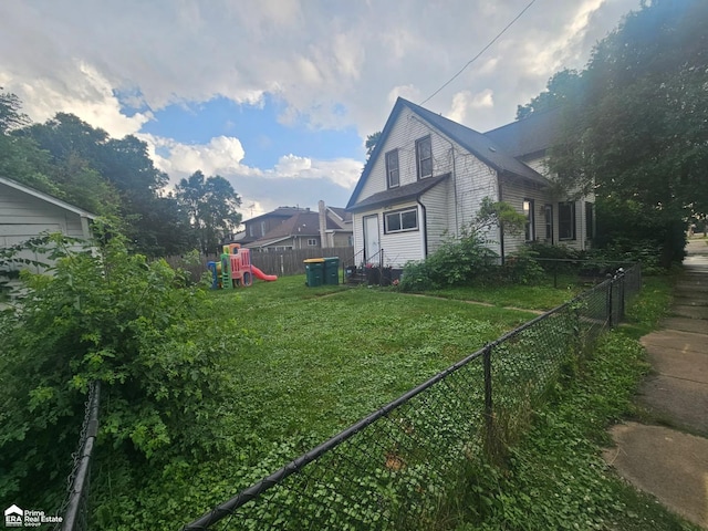 108 N Mercer St, Durand, MI 48429 - view of property exterior with a playground